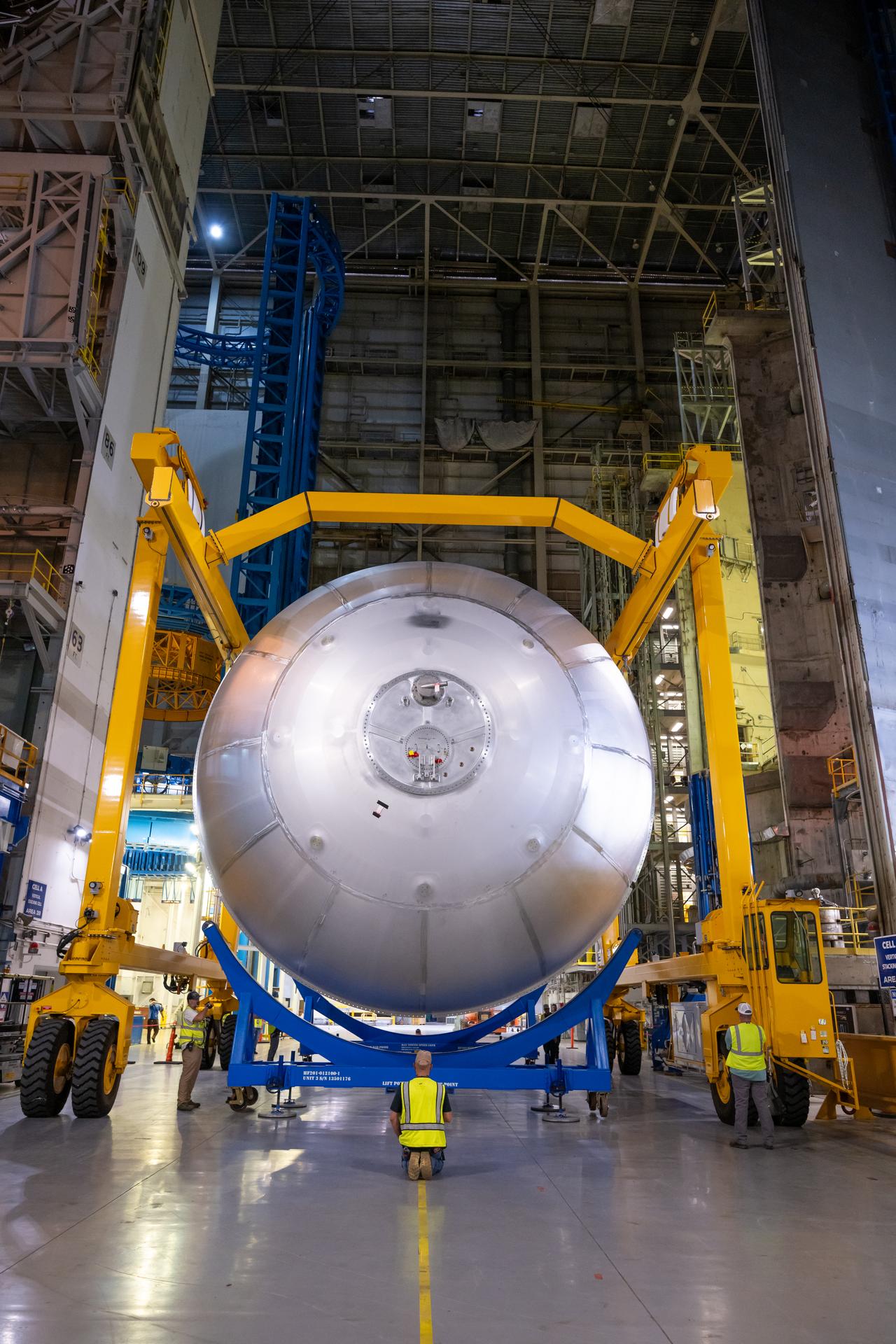 Teams at NASA’s Michoud Assembly Facility in New Orleans move a liquid oxygen tank from the main rocket factory into the adjacent vertical assembly building. The liquid oxygen tank, which will form part of the SLS (Space Launch System) rocket for NASA’s Artemis IV mission to the Moon, is rotated from a horizontal to a vertical configuration and loaded into the high bay’s hydrostatic proof testing cell. This non-destructive evaluation method tests the structural integrity of the tank’s welds by filling the tank with water, simulating the propellant used during launch. The propellant tank will hold more than 196,000 gallons of super-cooled liquid oxygen at launch and is one of five major elements that make up the 212-foot-tall SLS rocket stage. The core stage, along with its four RS-25 engines at its base, produces more than two million pounds of thrust to help launch NASA’s Orion spacecraft, astronauts, and supplies beyond Earth’s orbit and to the lunar surface for Artemis.